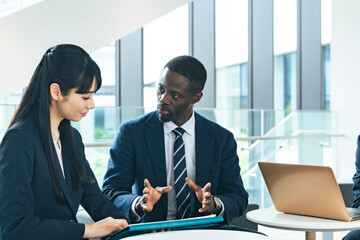 Group of multinational business people talking in a lobby