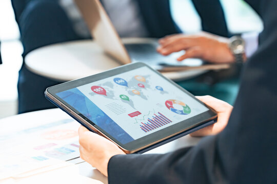 Business people attending a meeting with a tablet