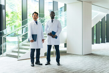 A group of multinational researchers or doctors lined up in the lobby