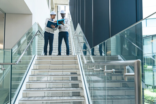 Group of multinational engineers having a conversation in a facility