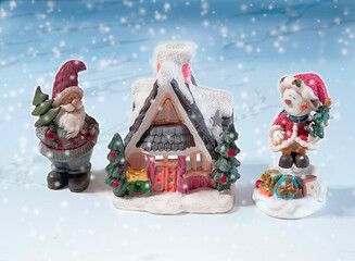Postcard with congratulations for Christmas and New Year with a New Year's house, Santa Claus and a...