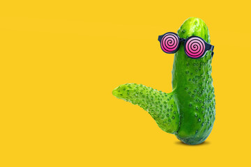 Cucumber with Phallic Shape and Hypnotic Glasses on Yellow..