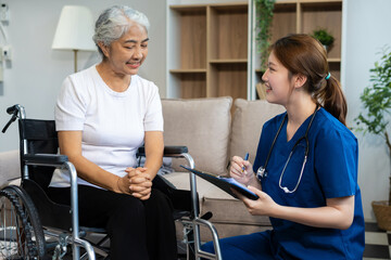 Fototapeta premium Female doctor consulting senior old patient filling form at consultation, talking to senior old patient filling signing medical paper at appointment visit in clinic.