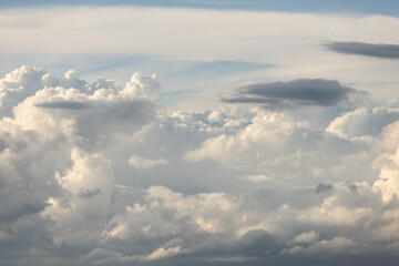 The sky is filled with clouds, creating a moody and somewhat ominous atmosphere. The clouds are scattered throughout the sky, with some appearing closer to the ground and others higher up