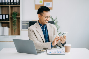 Fototapeta premium Businessman executive manager looking at laptop watching online webinar training or having virtual meeting video conference doing market research working