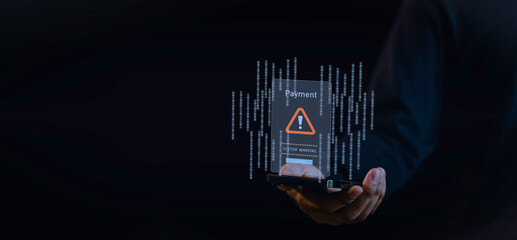 a hand holding a smartphone warning sign indicating a payment system warning. the alert, symbolizing online security threats, scam alerts, and the importance of secure digital transactions
