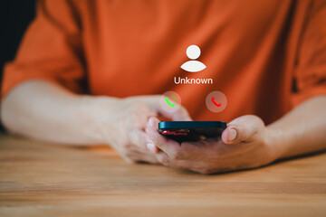 Man answering the incoming call. The phone call was from an unknown number. Hoax person with a fake...
