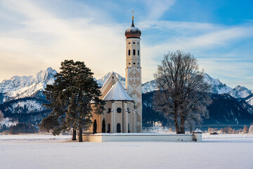 St. Coloman church near to Neuschwanstein castle with Tannheimer mountains in winter, Allgau, Germany