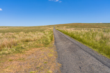 Rural road in the Peak District between Daddry Shield and Newbiggin, County Durham, England, UK