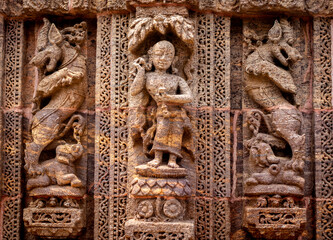 Temple platform of Jagamohana carved with erotic couples, young women flaunting their beauty in...