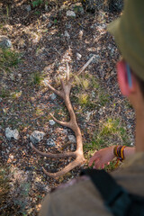 Hunter finding a deer antler.