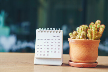 2024 Calendar desk placed on business office table. Desktop Calender for Planner to plan wedding agenda, timetable, appointment, organization, management each date, month, and year. Calendar concept.