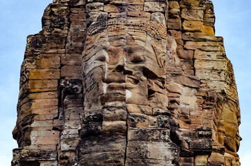 The bayon temple smiling stone faces showing on a sunny day in angkor thom, siem reap, cambodia