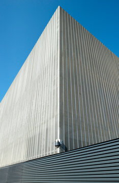 Data center building with security camera under blue sky on sunny day