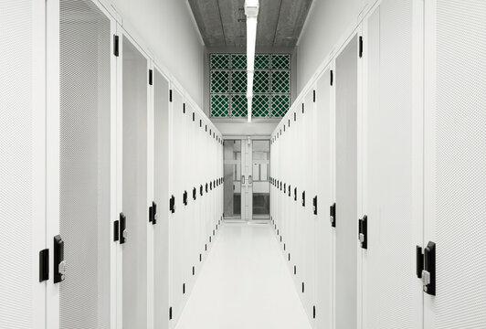 Illuminated server room with big data at center