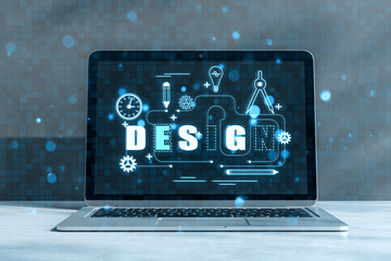 Graphic design concept outline. Close up of laptop with hologram on concrete wall background....