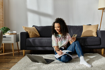 Woman sitting on floor, engrossed in cell phone.