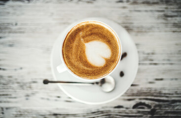 Fototapeta premium Cup with cappuccino, latte on table.