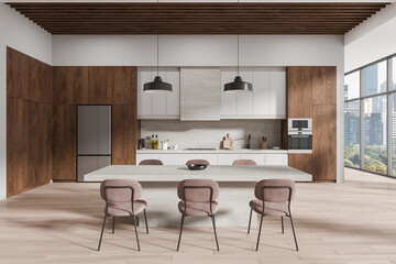 Stylish home kitchen interior with stone table and chairs, cabinet and window