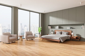 Stylish hotel bedroom interior with bed and armchairs, panoramic window