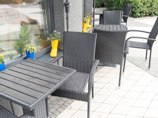 Close up of an empty table with empty chairs at a local outdoor resturant. 