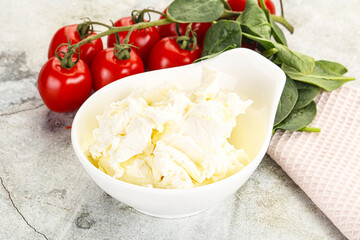Soft cream cheese in the bowl