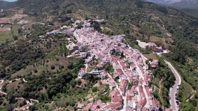 Aerial view showcases a picturesque mountain village set in the tranquil Mediterranean region. Castillo del Aguila, Gaucin pueblo, Malaga Spain