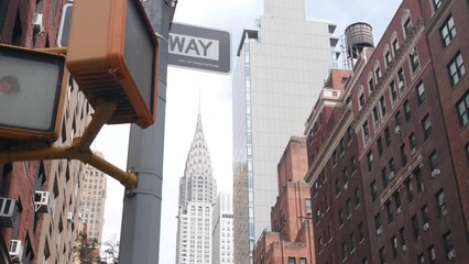 New York City crossroad, Lexington street intersection road sign post. Chrysler building, Midtown district, NYC, United States. Highrise skyscraper architecture, corner one way roadsign, traffic light