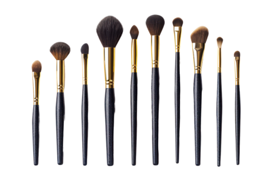 Collection of professional makeup brushes with black handles and gold accents, isolated on a white background. Perfect for beauty enthusiasts.