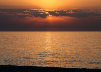 Sunrise over the Mediterranean Sea seen from the beach in Torremolinos. Costa del Sol, Spain