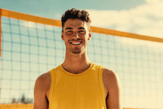 Australian male athlete smiling at camera during beach volleyball match on coastal summer games - Powered by Adobe