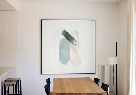 Mockup of square customizable picture frame on wall in room