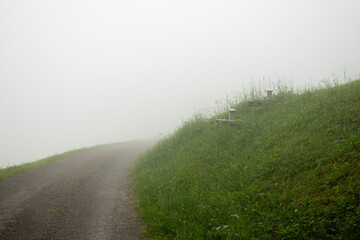 Gravel road in the fog . Schotterstraße im Nebel 