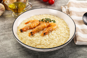 Italian risotto with prawn served thyme