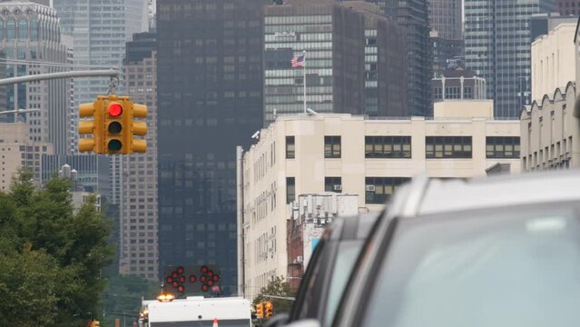 New York City street crossroad, yellow traffic light, transport road intersection, United States. Building architecture. Queens, Long Island. Manhattan cityscape, Midtown skyline, highrise skyscrapers