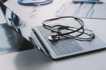 Stethoscope with prescription clipboard and Laptop ,Doctor working an Exam, Healthcare and medical...