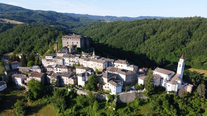Naklejka premium Aerial view of the small village of Compiano and the castle of Compiano. Compiano, Parma, Italy