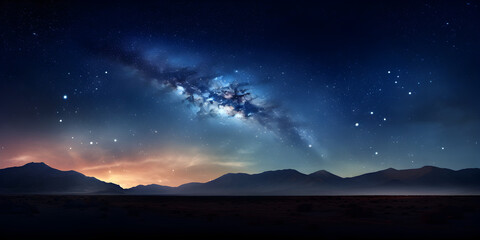 Fototapeta premium A clear night sky filled with stars and the Milky Way visible, with silhouettes of mountains
