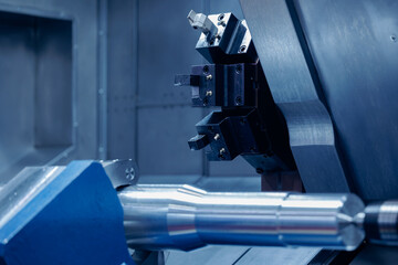 CNC turning production of shafts for cars factory. Concept blue heavy industry background, machine...