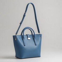 Stylish blue women's handbag, fashionable purse bag isolated on a white background