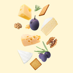 Different types of cheese, crackers, grapes, rosemary and walnuts in air on beige background