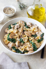 Farfalle pasta with mushrooms and spinach. Healthy eating. Vegetarian food.