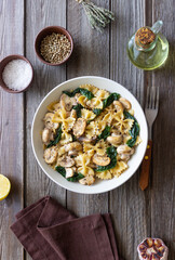 Farfalle pasta with mushrooms and spinach. Healthy eating. Vegetarian food.