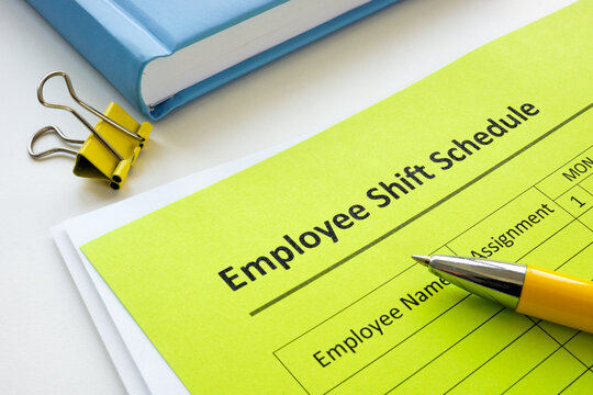 Employee shift schedule form and pen.