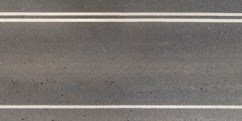 view from above on texture of asphalt road with cracks