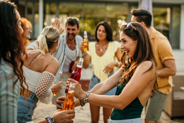 Diverse friends add to the excitement as they join in dancing at the villa pool party