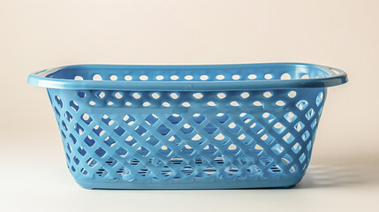 Obraz premium Empty blue plastic laundry basket with a perforated design on a plain white background.