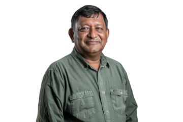 Smiling mid-age Indian man using a laptop.