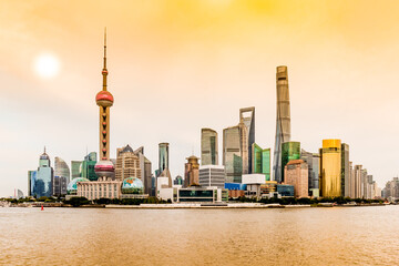 Obraz premium Colorful sunset over the financial district of Shanghai, China