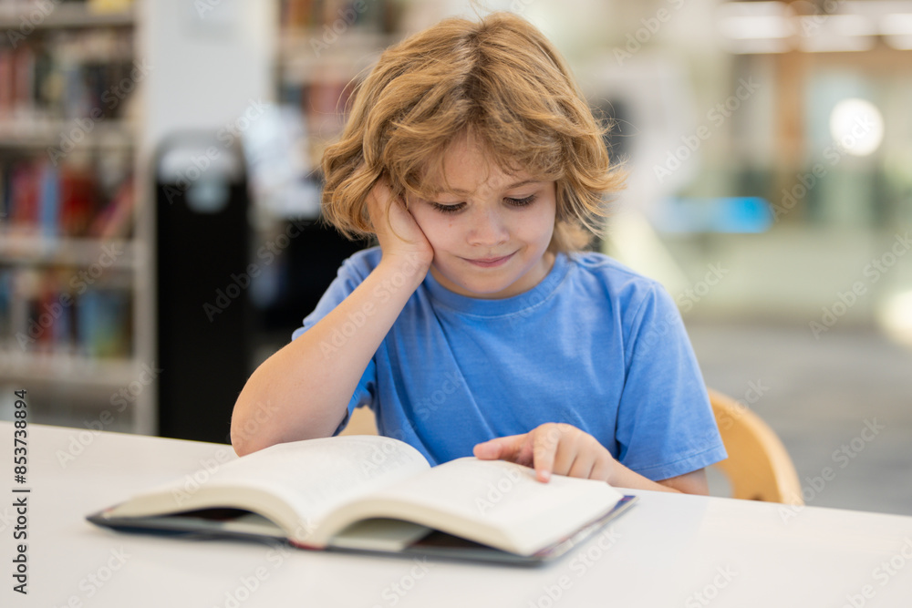 Poster kid reading book. child reading book in school library. learning from books. school education. back 
